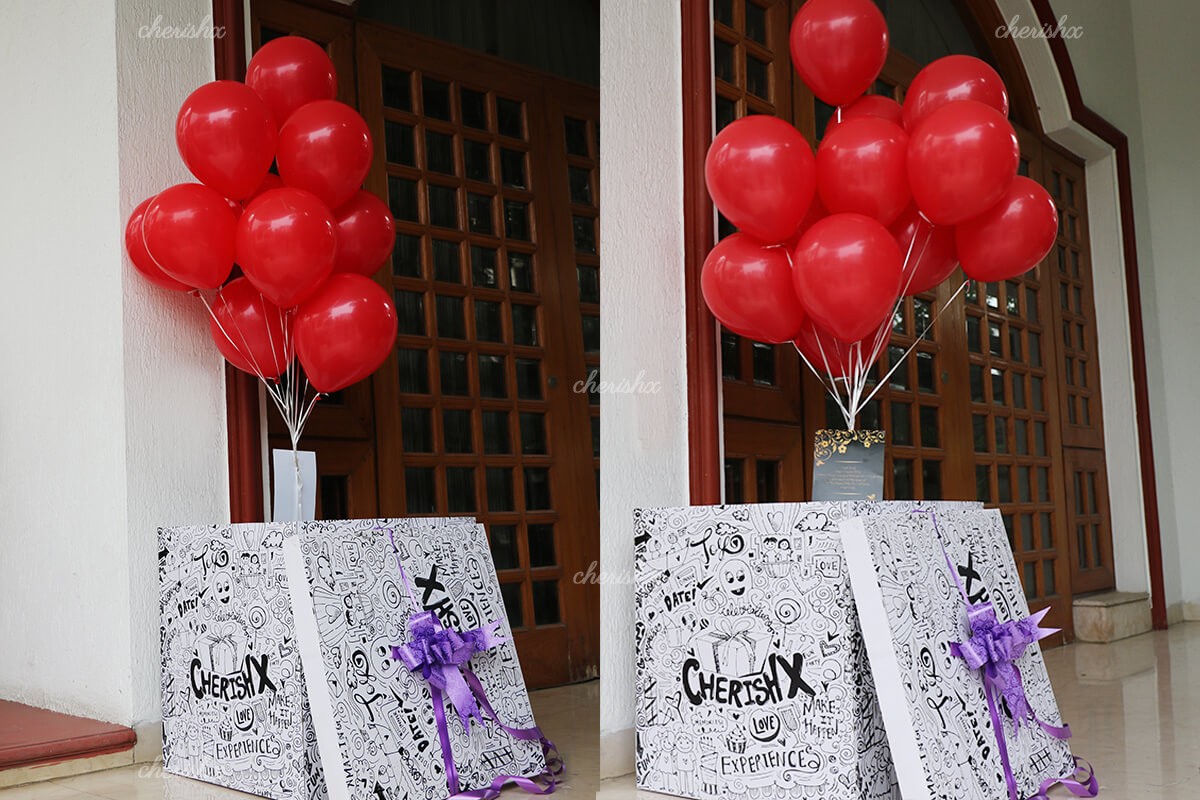 Red Helium Balloons coming out of the Surprise Box.
