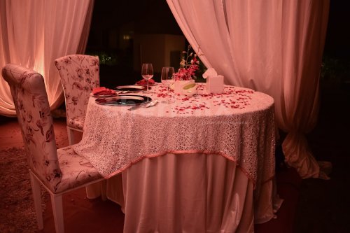 Beautifully Decorated Table with Rose Petals & Flowers