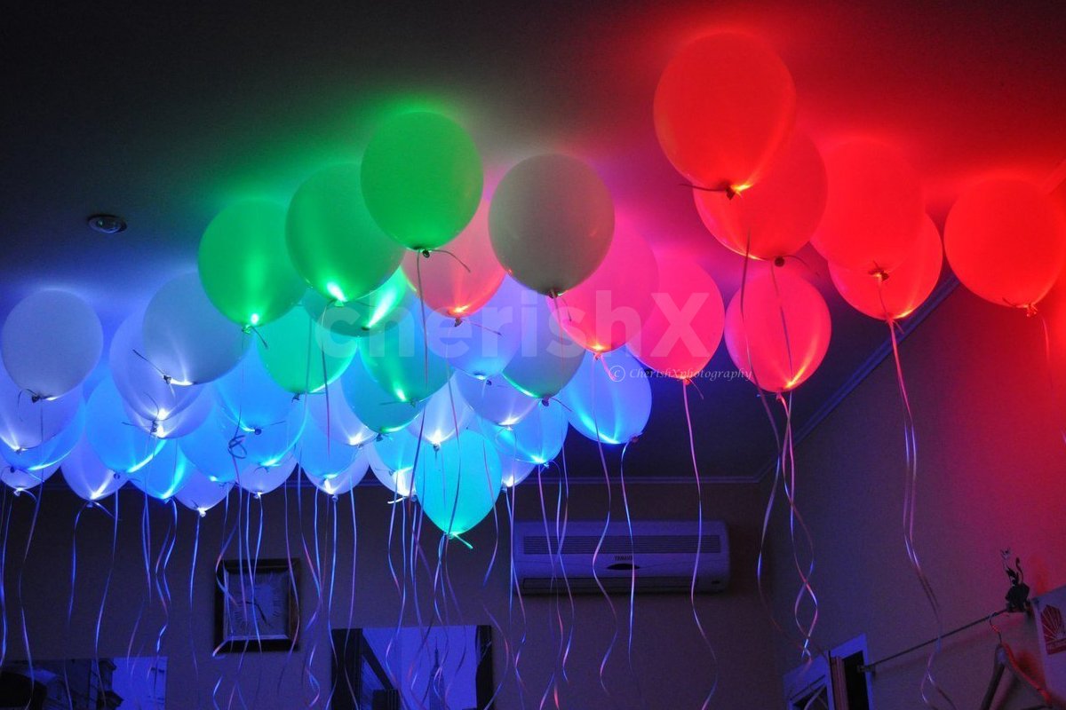 birthday decoration in room with glow in dark balloons 