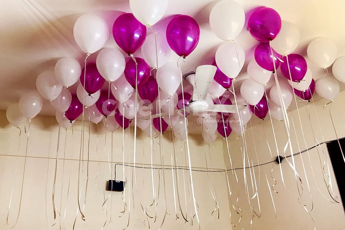 Pink and White Balloons glued to the ceiling for Balloon room decoration in Bangalore.
