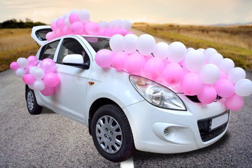 Get the car beautifully decorated for celebrating a baby shower.