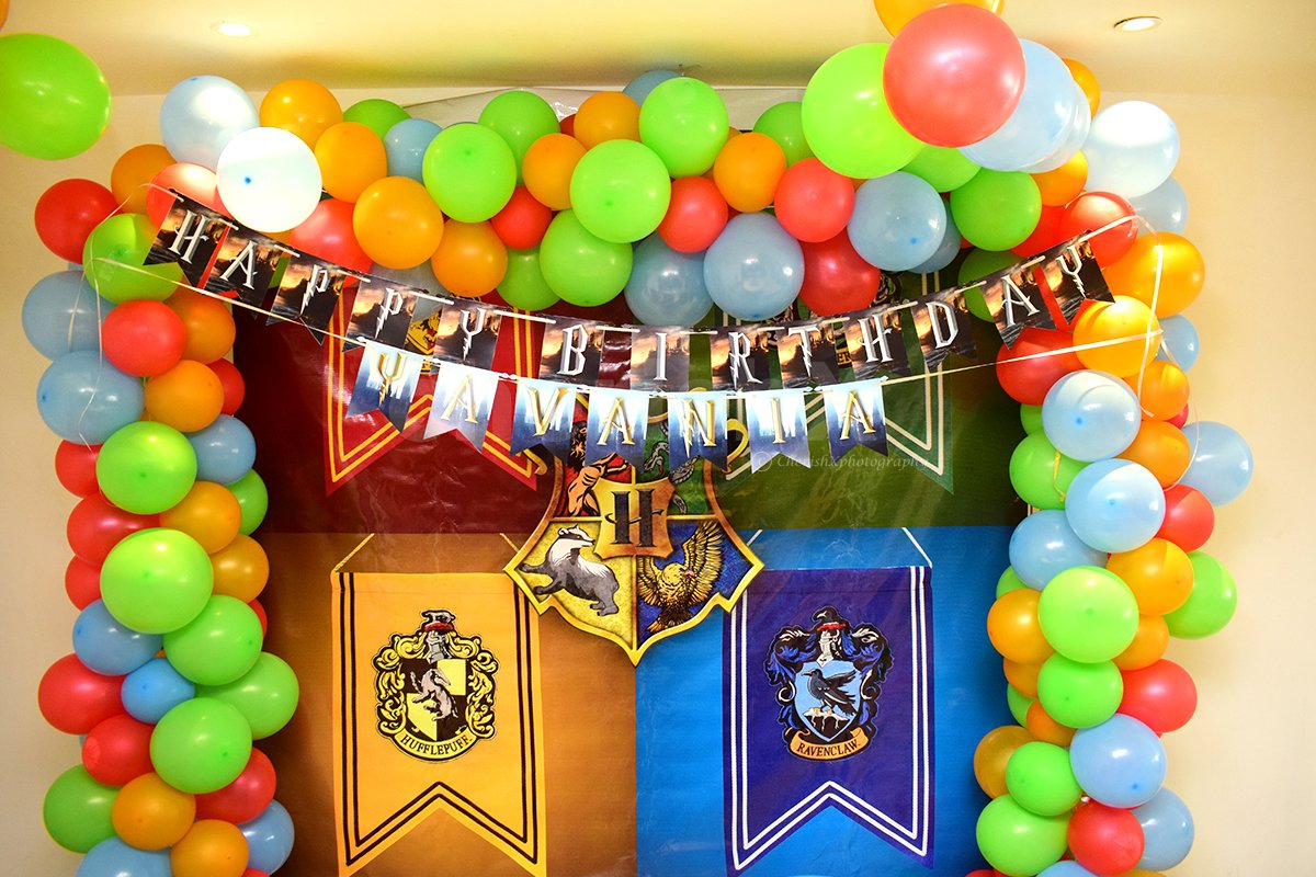 The Harry Potter Wall Decor with Harry Potter Themed Bunting and the four famous Houses in the Howgwarts.