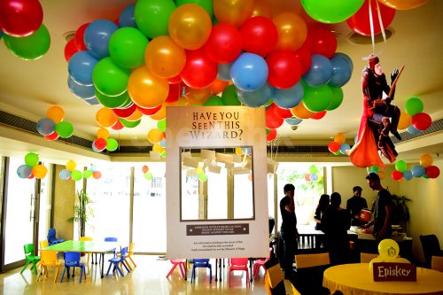 Coloured Bunches of balloons and Harry Potter Themed Photo Frame to create the Harry Potter Feels.