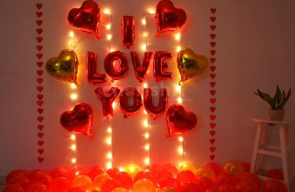 Romantic Balloon Decoration with I LOVE YOU foil balloons, heart shaped foil balloons and fairy lights