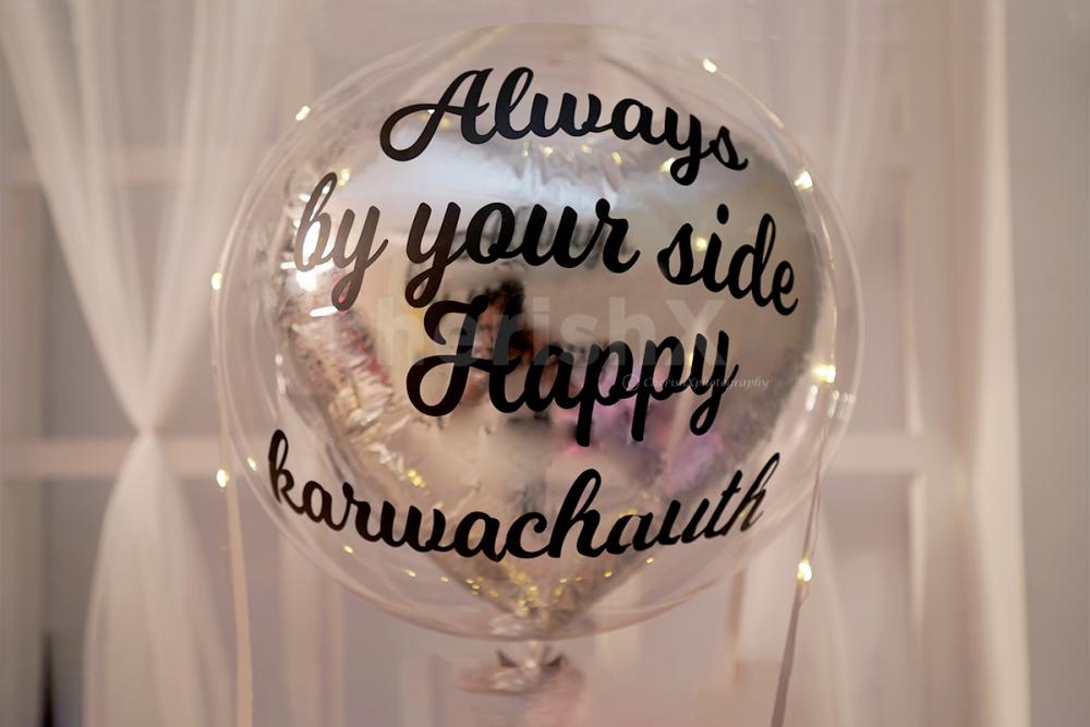A Bubble Balloon with Silver foil balloon inside with vinyl printing.
