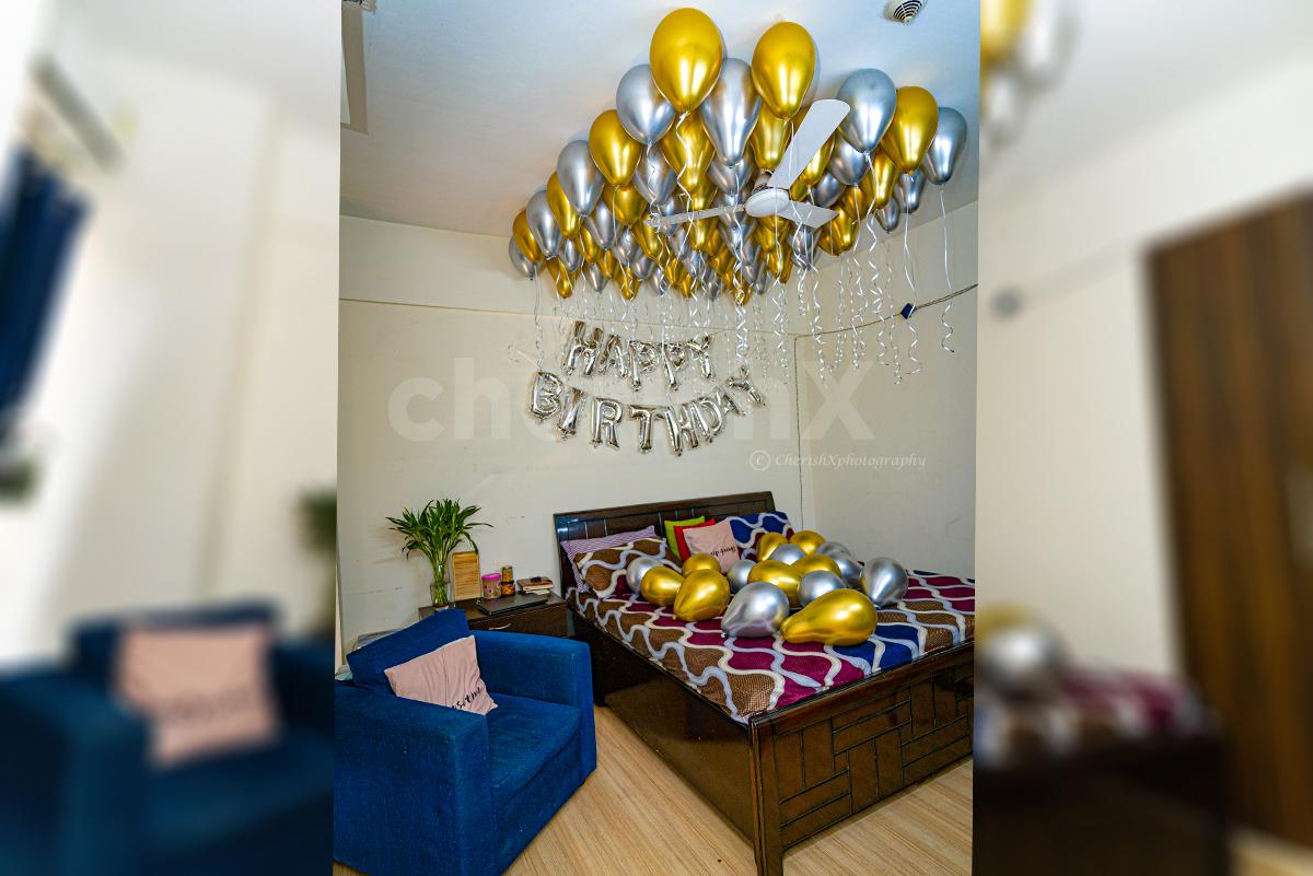 Golden and silver chrome balloon decoration by Cherishx at INR 2199