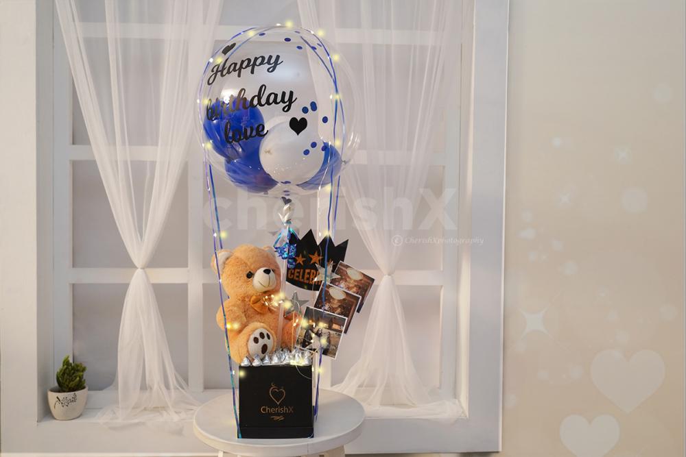 A cute teddy and chocolate box bucket to gift to your close ones.