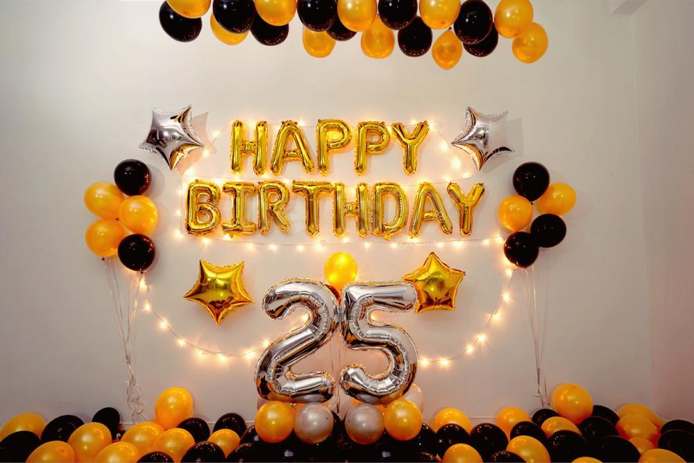 Happy Birthday wall decoration with a Golden and black theme.