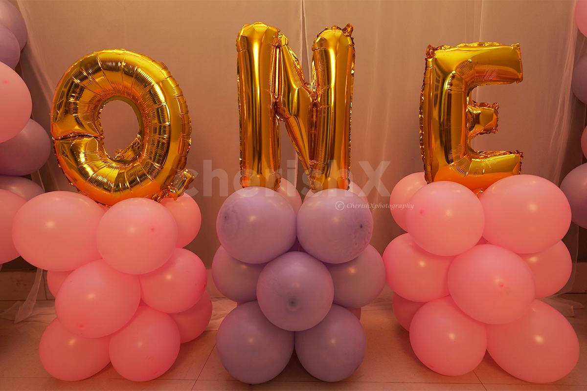 ONE Foil Balloon Letters in Golden to make the decor attractive!