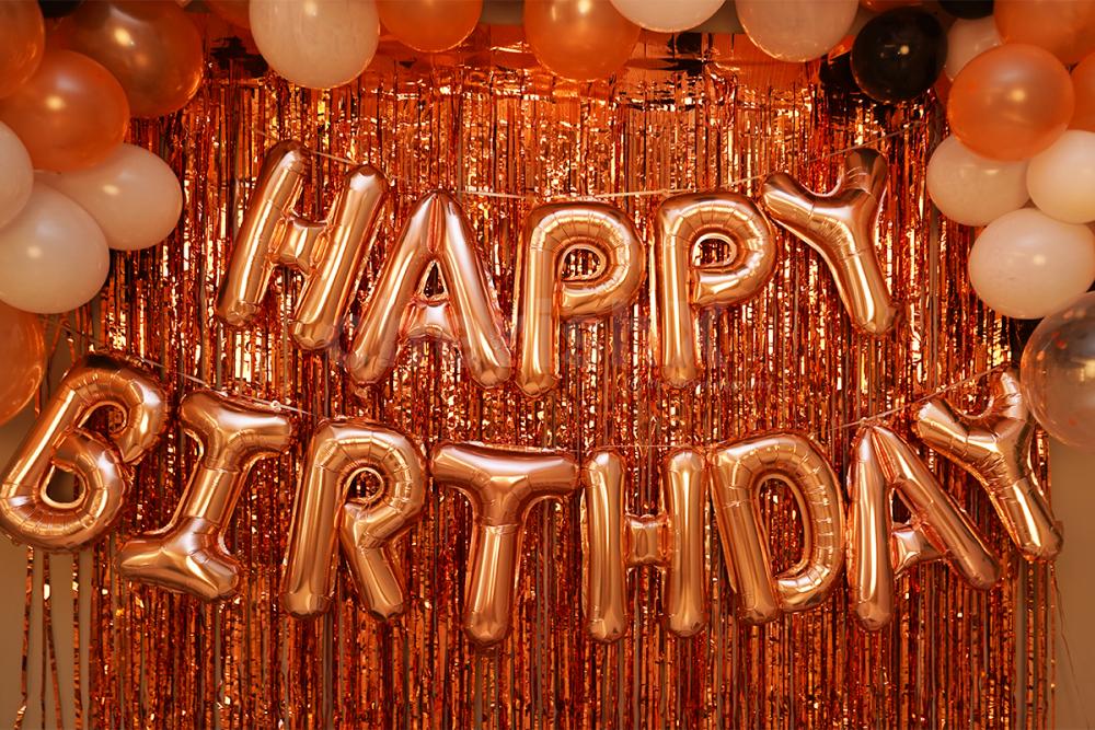 Rose Gold Happy Birthday Foil Balloons to enhance the room decor.