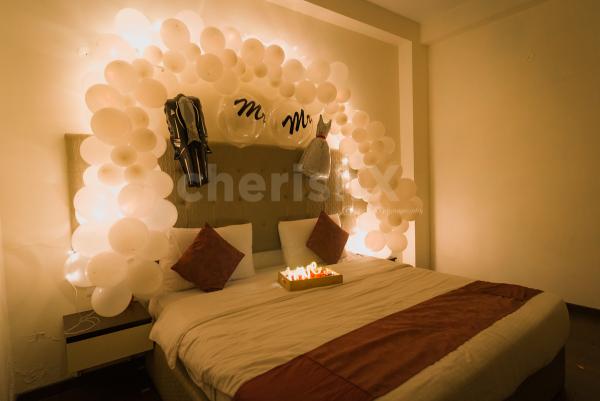 Book CherishX's White Themed Premium First Night Wedding Decor for a lovely night.
