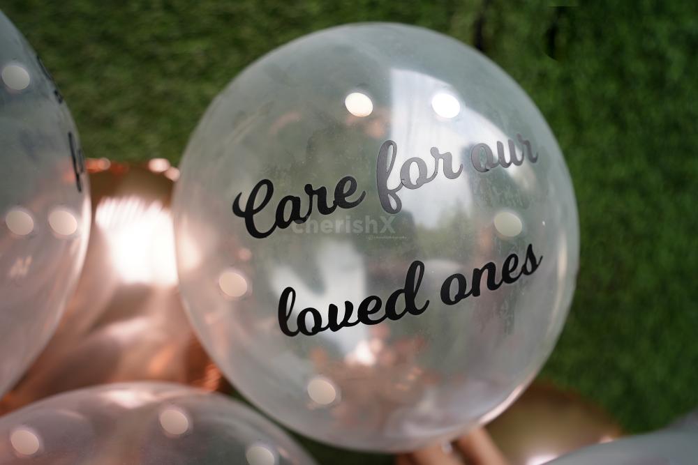 A printed vinyl promise on helium confetti balloons.