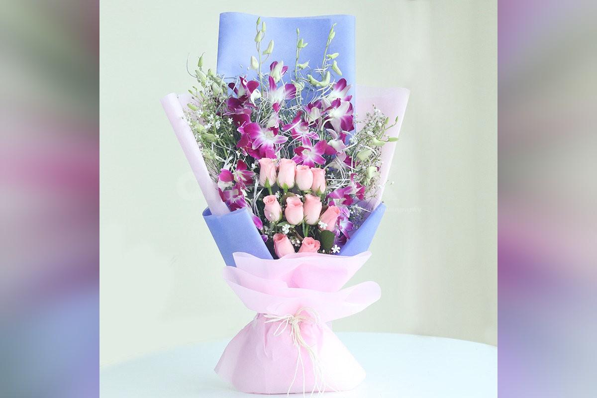 6 Purple Orchids and 10 Pink Roses in a Paper Bouquet