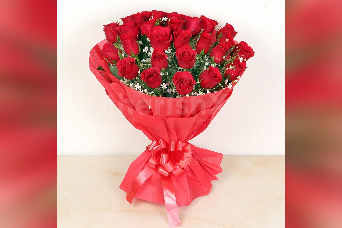 Send a simple 30 Red Roses in red color paper Bouquet to surprise them