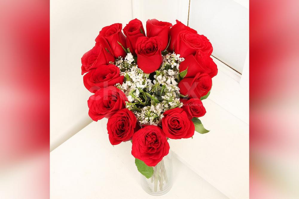 Send a simple Heart Shaped Arrangement of 15 Red Roses in Glass Vase to