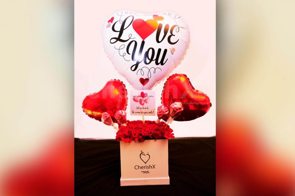 A captivating Red Carnations Love Balloon Bucket to captivate your loved one's heart!