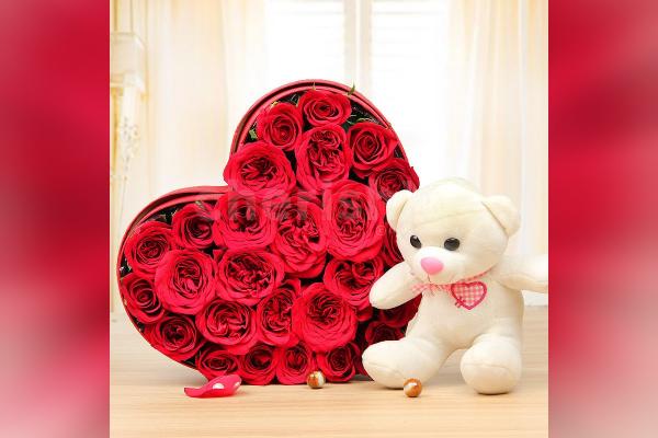 A 25 Red Rose arrangement in a heart shape and a 6' ft white teddy.