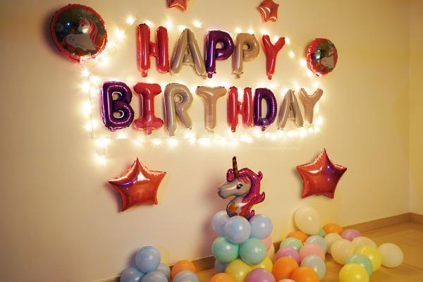 The Unicorm Birthday Surprise Decor includes different colored pastel and foil balloons!