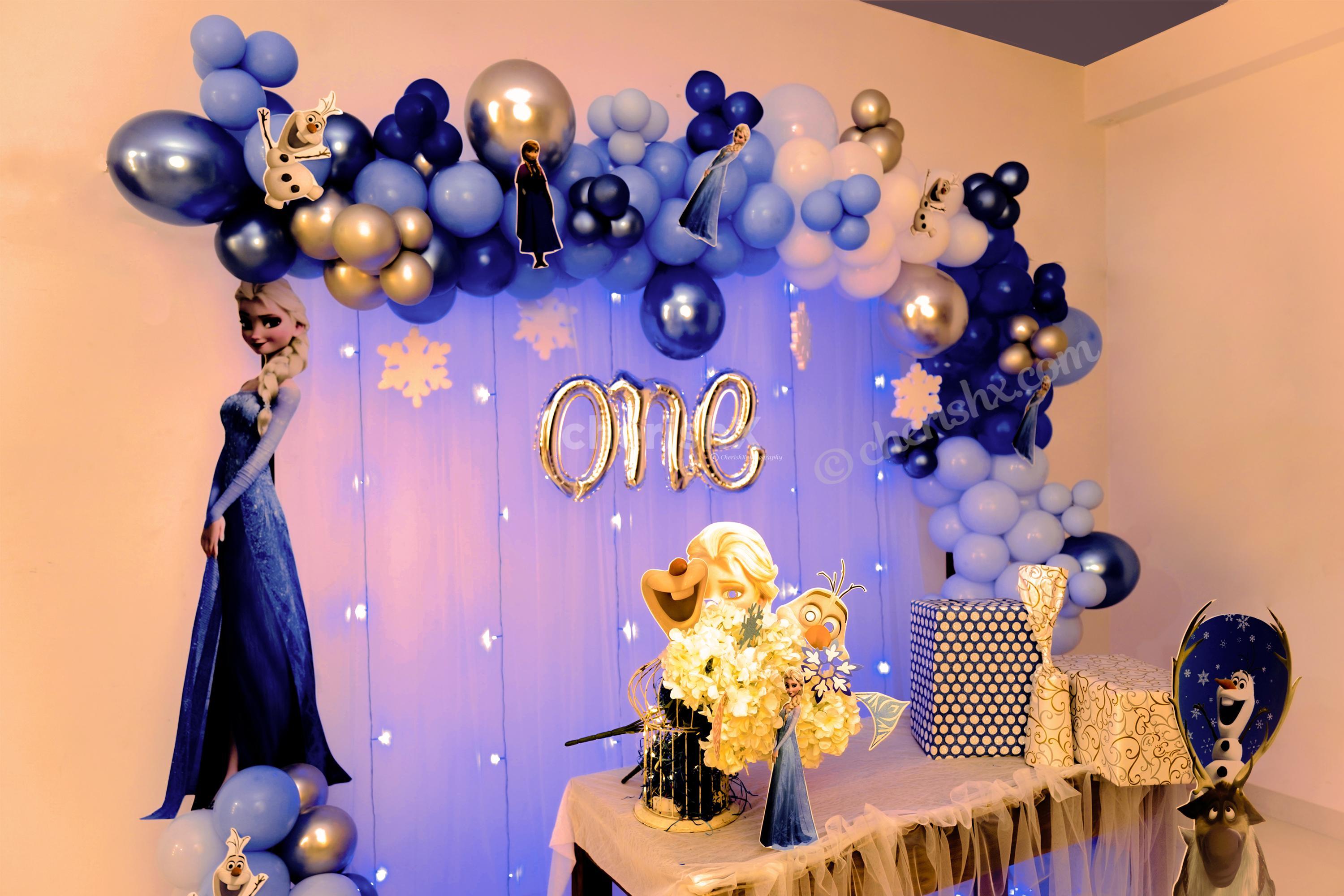 Disney's Frozen Themed Decoration includes character cut-outs and metallic and chrome balloons.