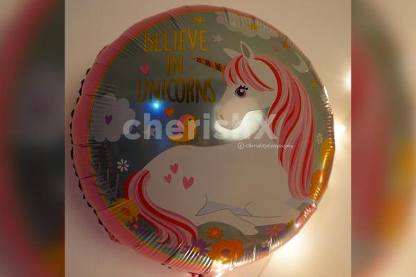 A Unicorn Themed Foil Balloon in Circle Shape