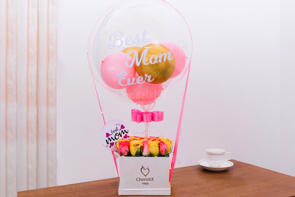 Surprise your Mother on her birthday or Mother's Day with this exquisite Mother's Day Balloon Bucket with Flowers!
