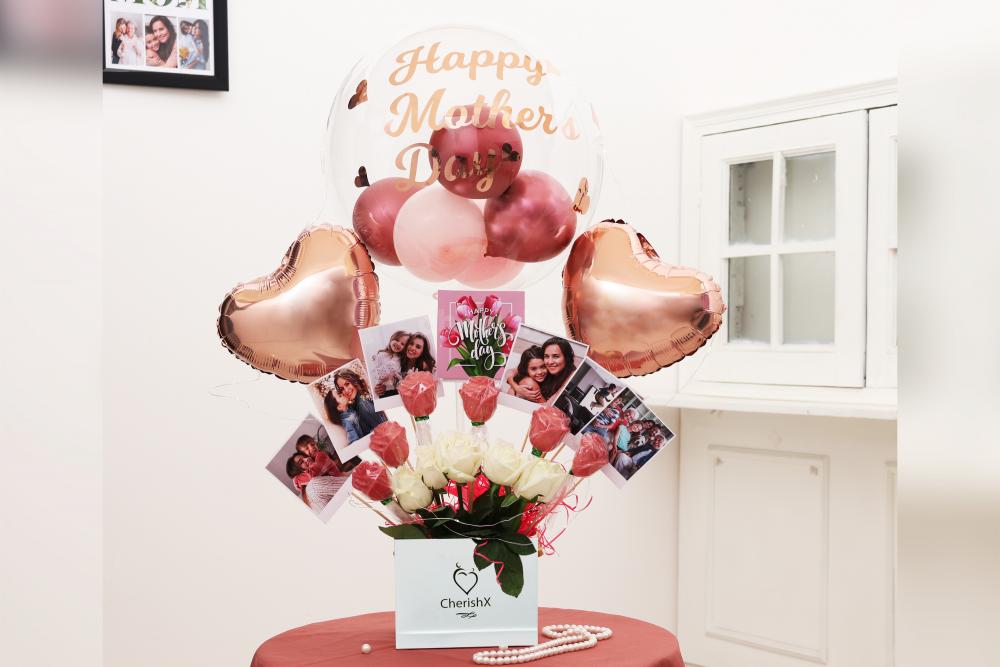 CherishX has launched an Exclusive Rose Gold Mother’s Day Gift Bucket filled with Balloons and more to help you make the Day Memorable for your Mother.