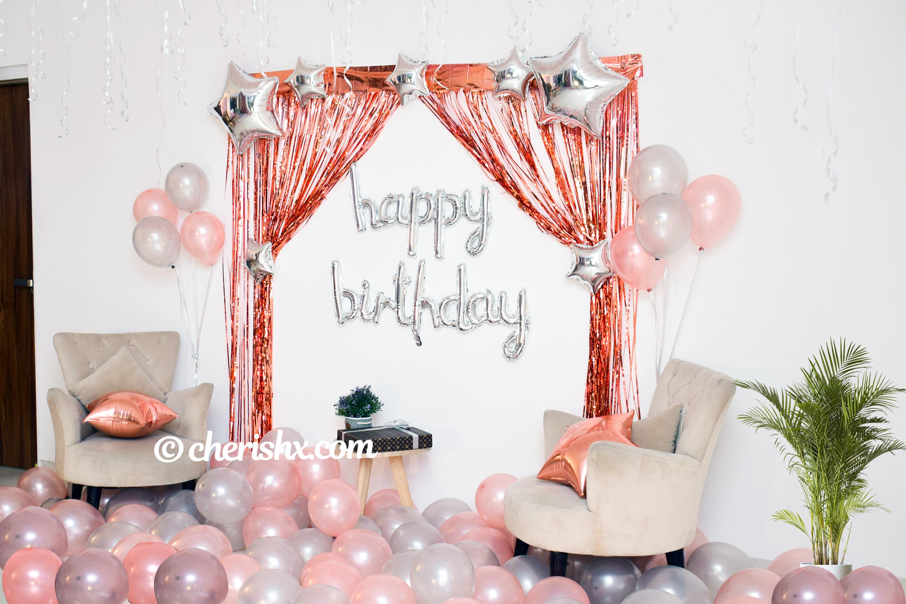 CherishX's Happy Birthday Rose Gold Surprise Decor with rosegold and metallic balloons.