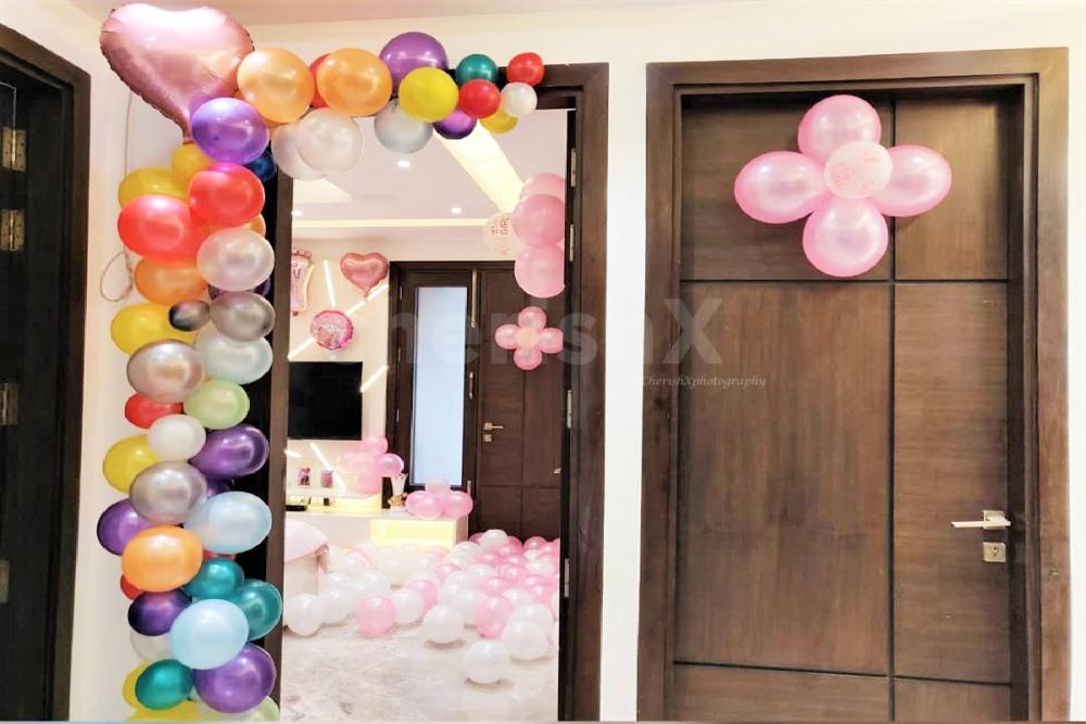 CherishX's Welcome Baby Girl Decor in a room with bunches of pink colour balloons.