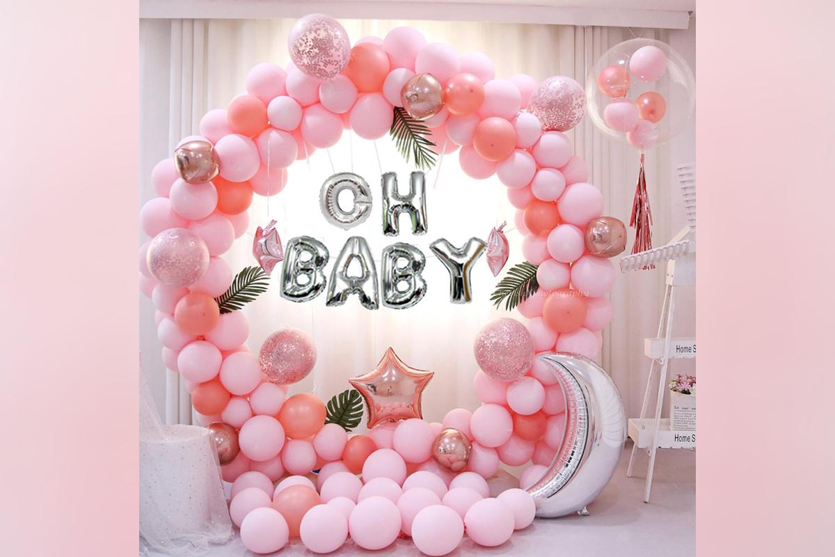 A beautifully curated baby shower decor in shades of pink.