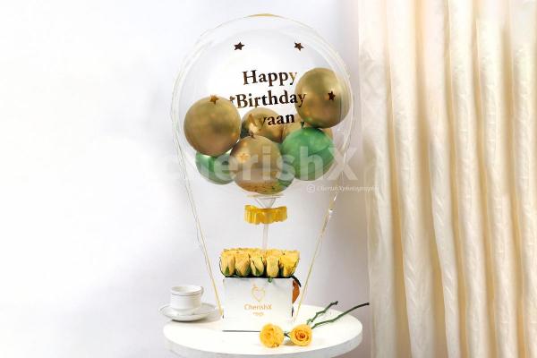 Send wishes with this extraordinary Gold & Green Balloon Bucket delivered anywhere in Bangalore