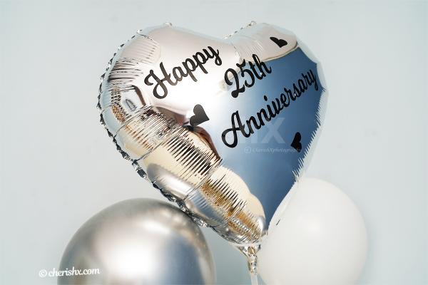 Silver Heart-shaped Foil Balloon with a Vinyl printed message on it.