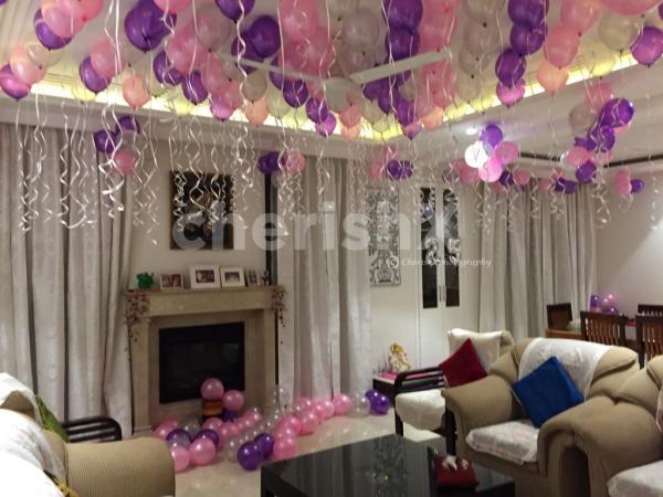 Beautiful Balloon Decor with hanging photos at your home in Hyderabad
