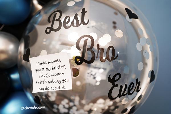 A bubble balloon with silver confetti with a message highlights the balloon bunch.