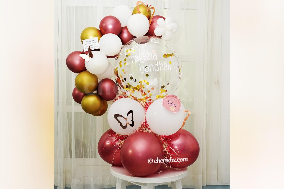A message attached with the Gold & Rose Gold Rakhi Balloon Bouquet.