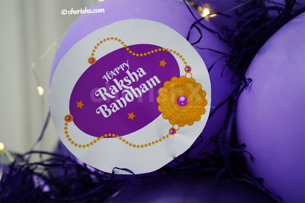 A Raksha Bandhan message attached with the Best SIS Lavender Balloon Bouquet