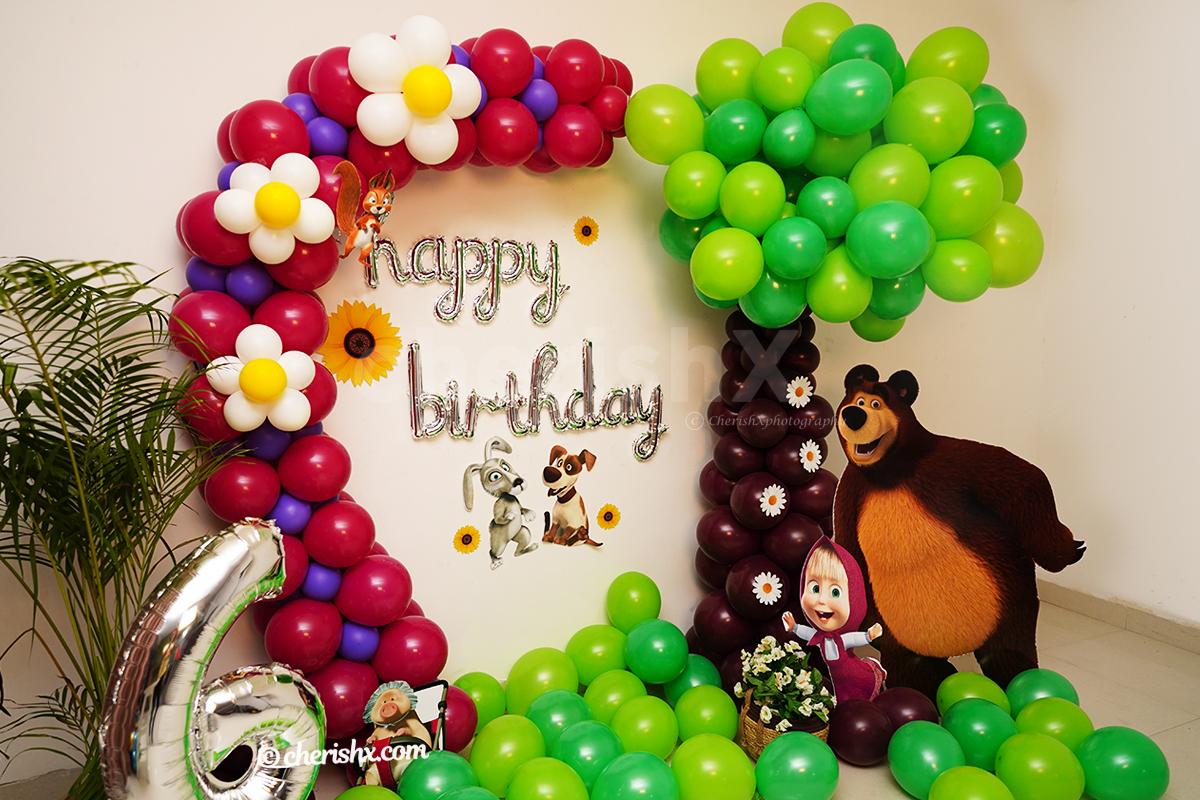 Masha and Bear Themed Decor: The wall is decorated with balloons and sunflower cutouts.