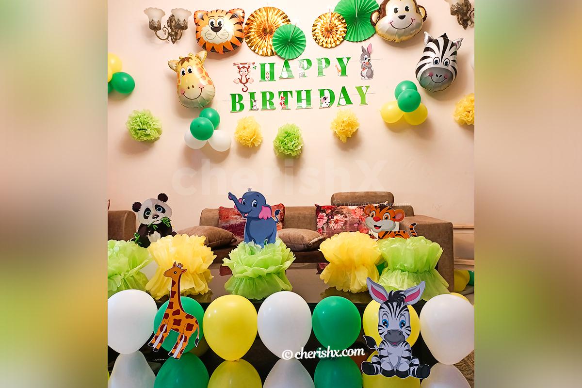 CherishX's Jungle Themed Birthday Decor includes wall and table decor with themed cut-outs.
