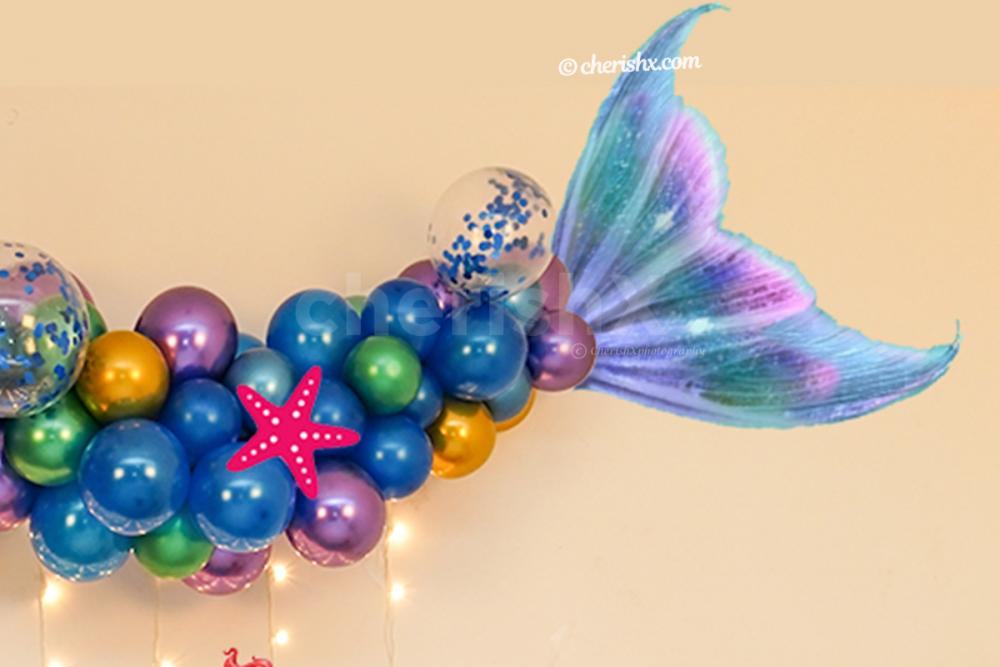 A Classy Mermaid Theme Wall Decoration for your kid's birthday.