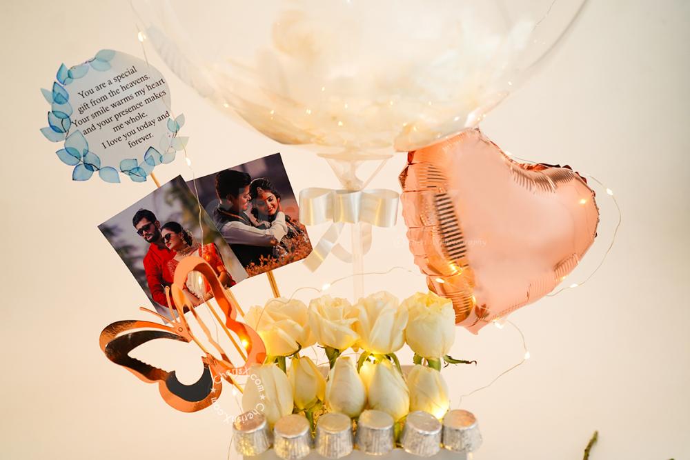 CherishX's Premium Feather Balloon Bucket includes photos, Roses and Chocolates.