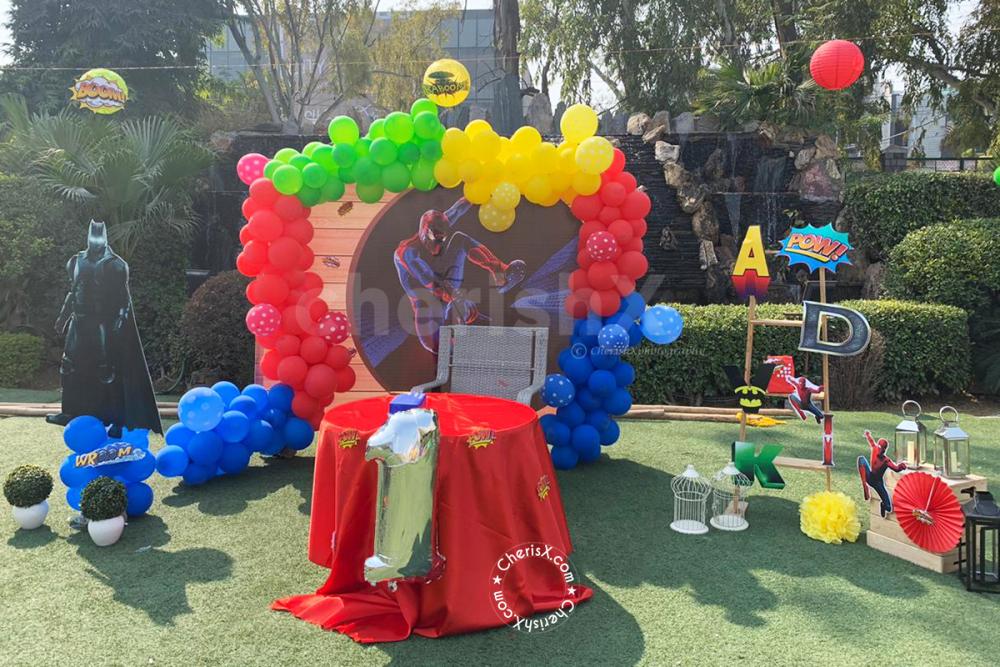 Bulding Structure with superhero cutouts and a personalised backdrop available in Superhero Themed Birthday Decor!