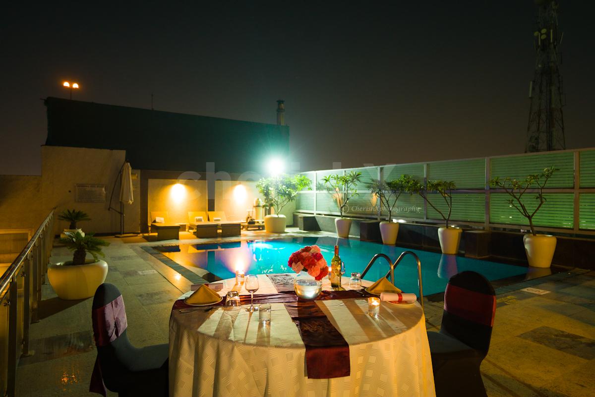 Romantic poolside candlelight dinner by country inn