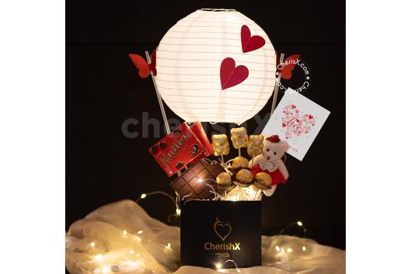 Celebrate this Valentine's Day and week beautifully with CherishX's Exclusive Chocolate Parachute Bucket Gift!