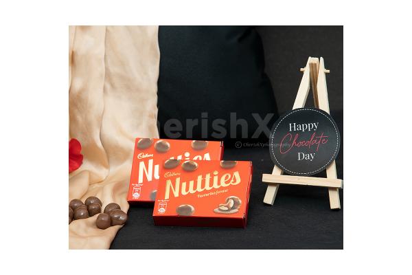 A Romantic Valentine's Countdown black box includes nutties for Chocolate Day