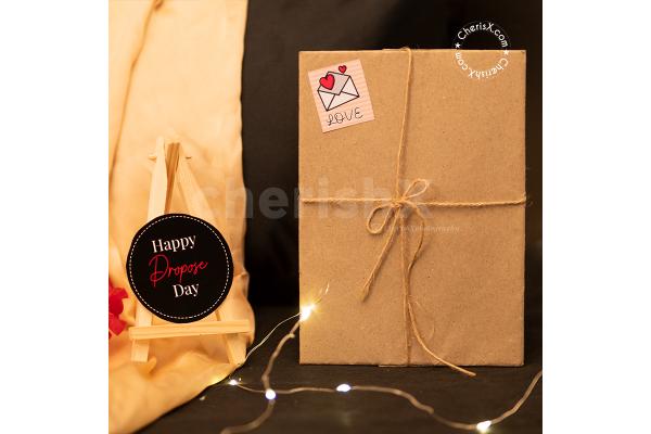 A Romantic Valentine's Countdown black box includes a beautiful Love Contract for Promise Day