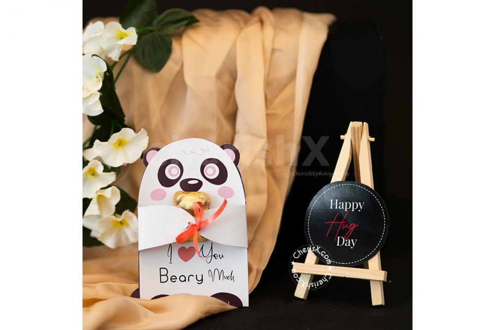 A Romantic Valentine's Countdown black box includes a cute Panda Card for Hug Day