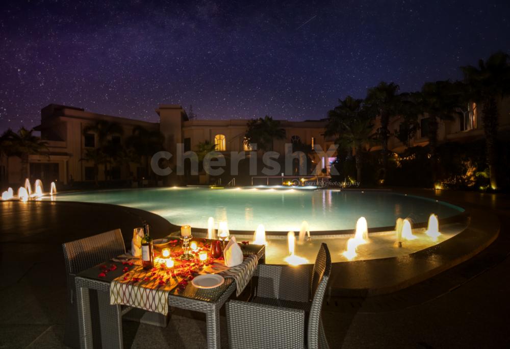 Enjoy the Pool view and the delectable food by booking this Private Poolside Dinner Experience by CherishX!