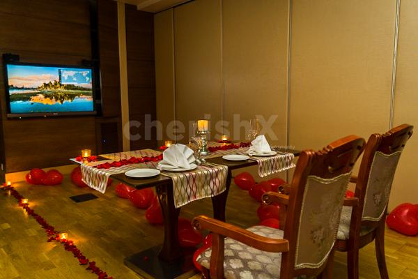 Plan a romantic date by booking a Private Dinner and Movie at Umrao Package offered by CherishX!