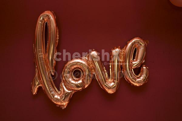 cursive love balloon in rosegold color