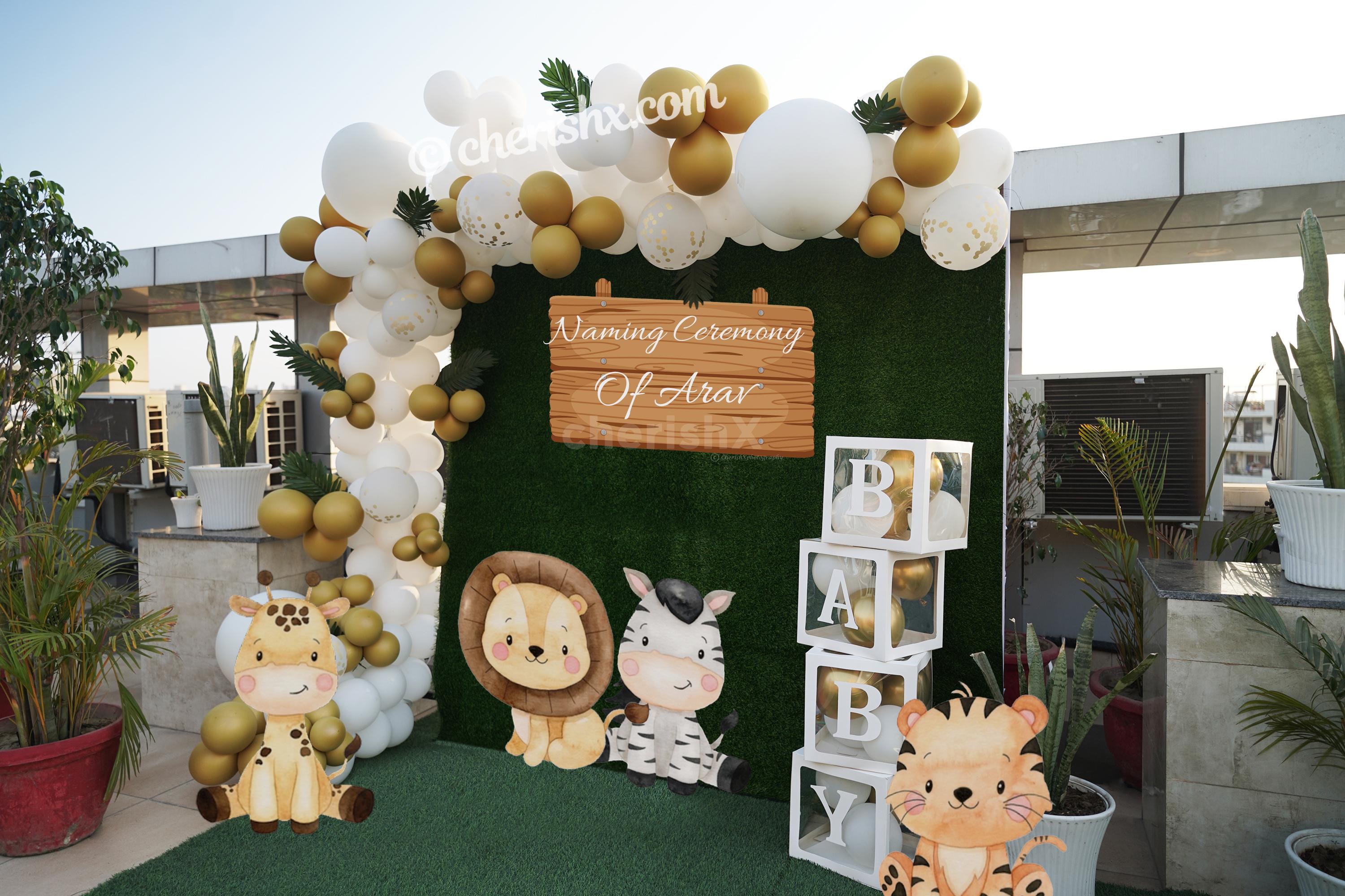 Arrange a perfect naming ceremony decor for your celebrations with CherishX's Jungle Safari Theme Balloon Decor.
