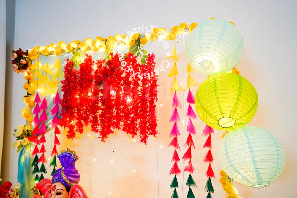 Garlands hanging from the ceiling for decorting the walls of the home for Ganesh Chaturthi!